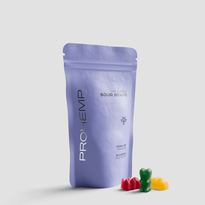 Resealable purple pouch of CBD gummies labeled Sour Bears with colorful bear-shaped gummies.
